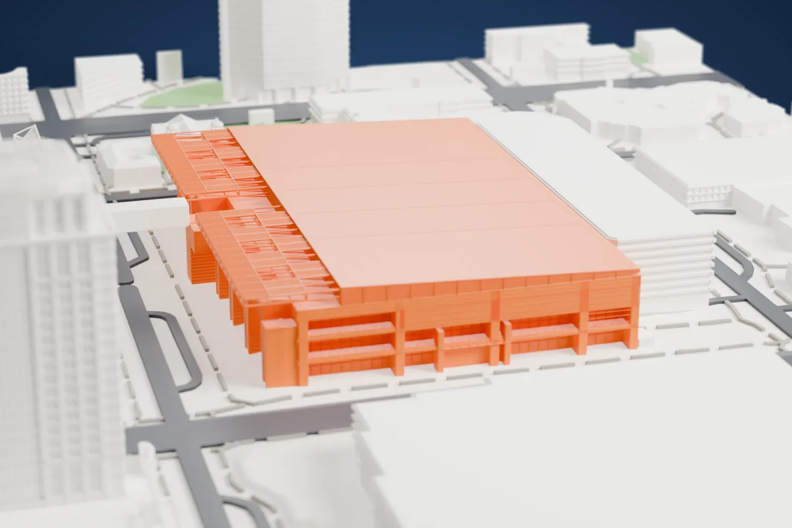 A white 3D print of the Phoenix Convention Center, a very large low block with thin steel canopies along its edges, among downtown streets, parks and taller buildings.
