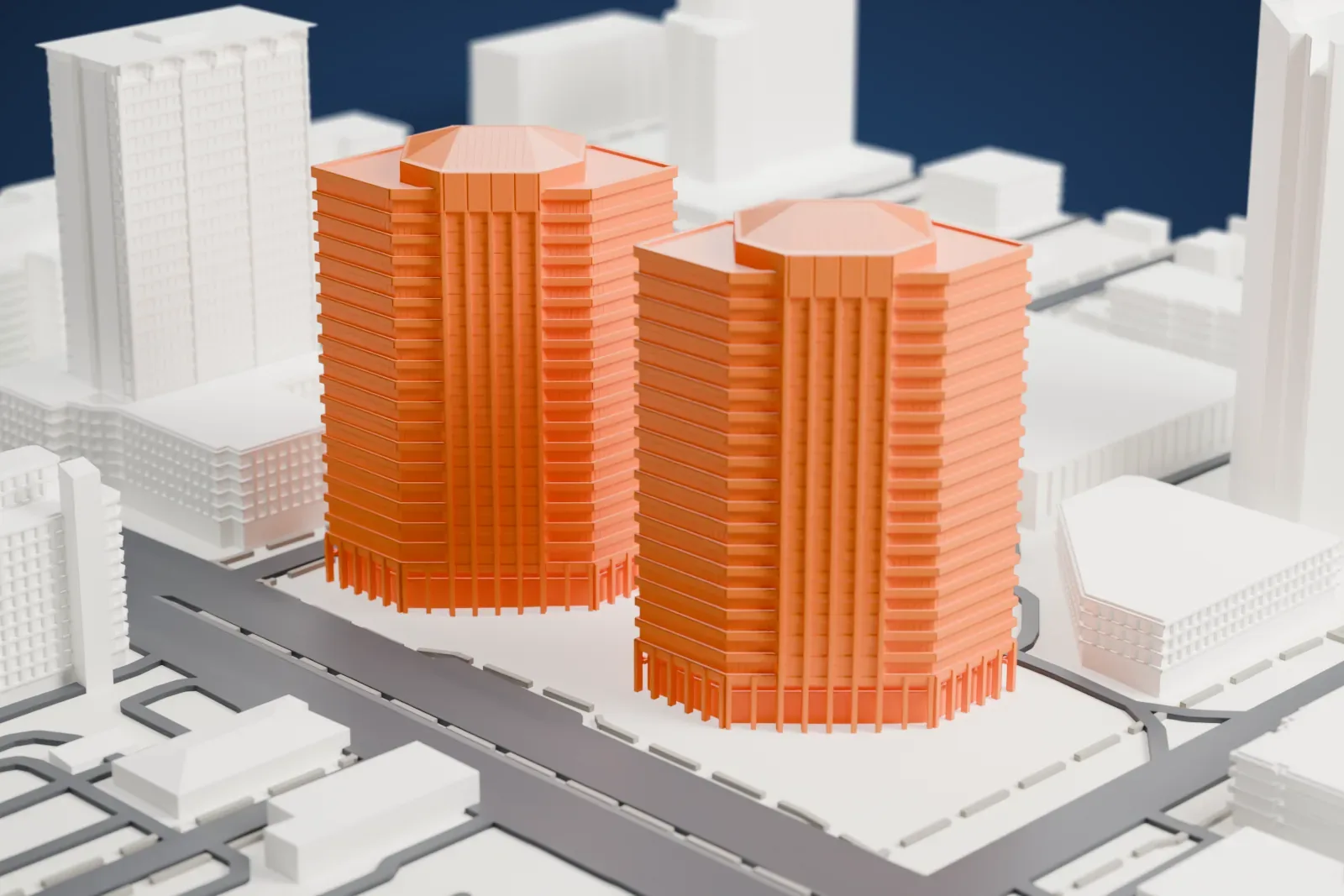 A white 3D print of two tall towers with hip roofs and ribbed sides, standing on an open plaza with a small octagonal water feature, among other buildings and streets.