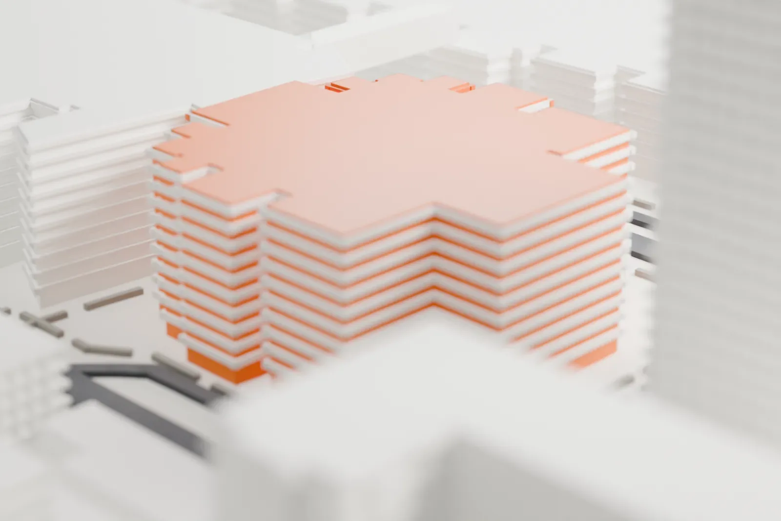 A white 3D print of Phoenix Symphony Hall, a cluster of blocky, stepped volumes under a faceted roof, hemmed in by larger buildings and streets.