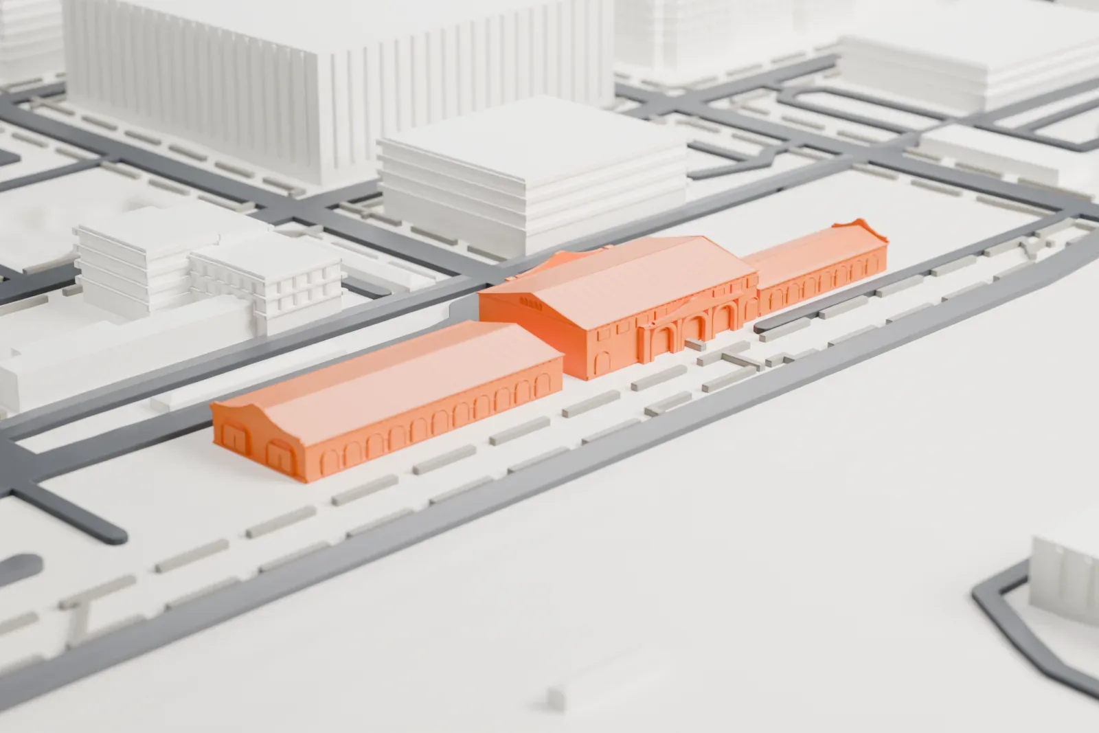 A white 3D print of Phoenix Union Station, a long, low building with arcaded wings and a taller central pavilion, standing on open ground with streets and larger buildings around it.