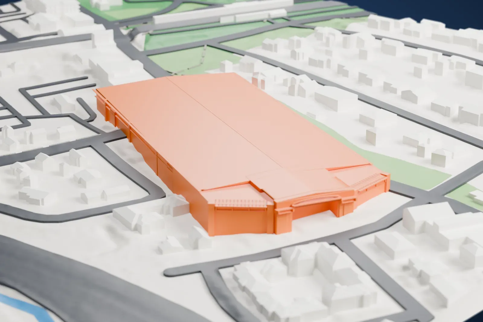 A white 3D print of the Picture House Regional Film Center, a long building with angled ends, among houses, parking lots, streets and green park areas.