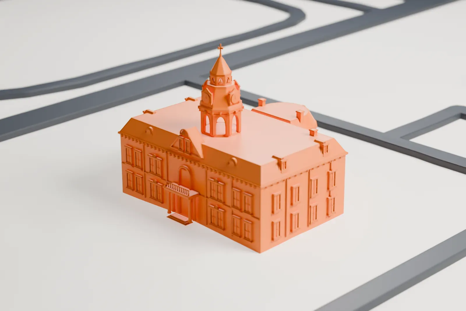 A white 3D print of the Second Pinal County Courthouse, a three-story building with a central cupola topped by a cross and a rounded bay on one side, on open ground beside streets.