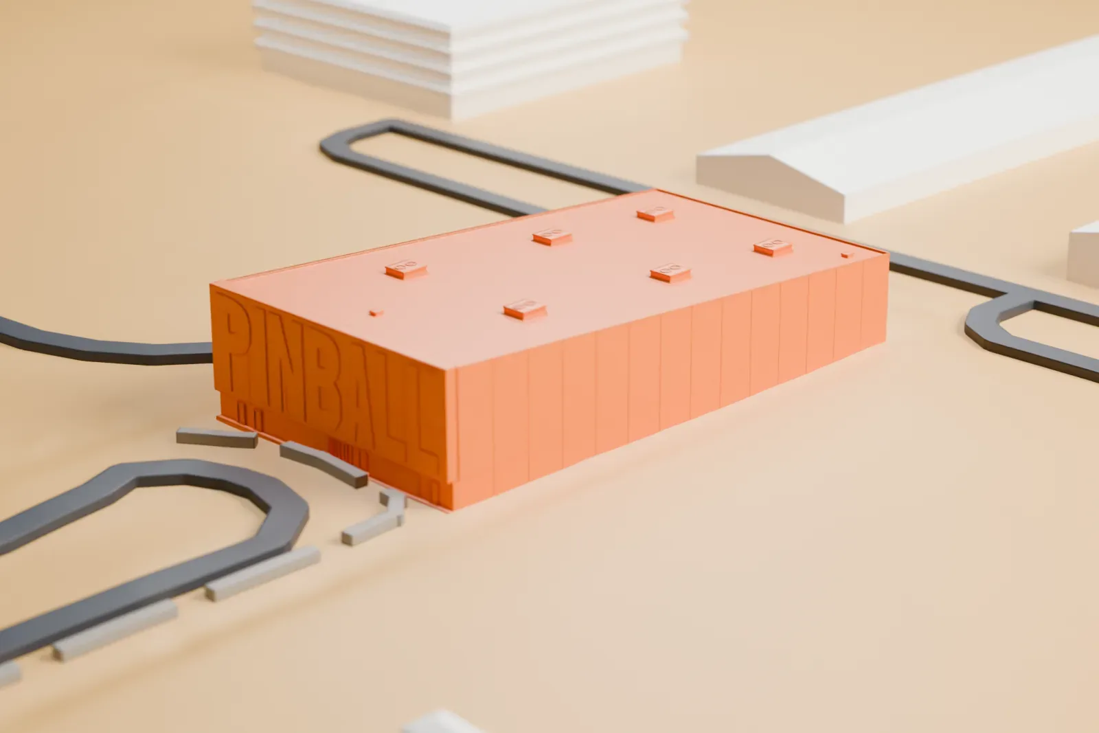 A white 3D print of the Pinball Hall of Fame, a plain box-shaped building with a flat roof and lettering on one wall, on an open lot beside curved roads.