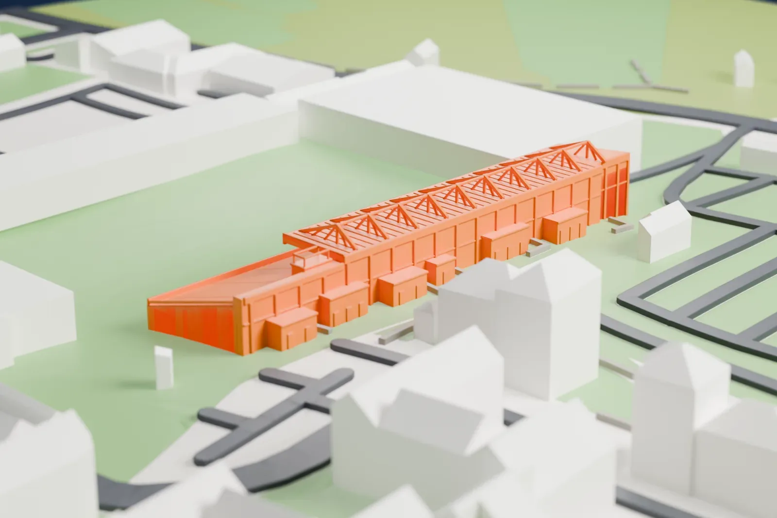 A white 3D print of the Pittodrie Stadium stand, a long shallow rake of seats under a flat roof with white lattice trusses and open rows at one end, on a base of surrounding streets and buildings.