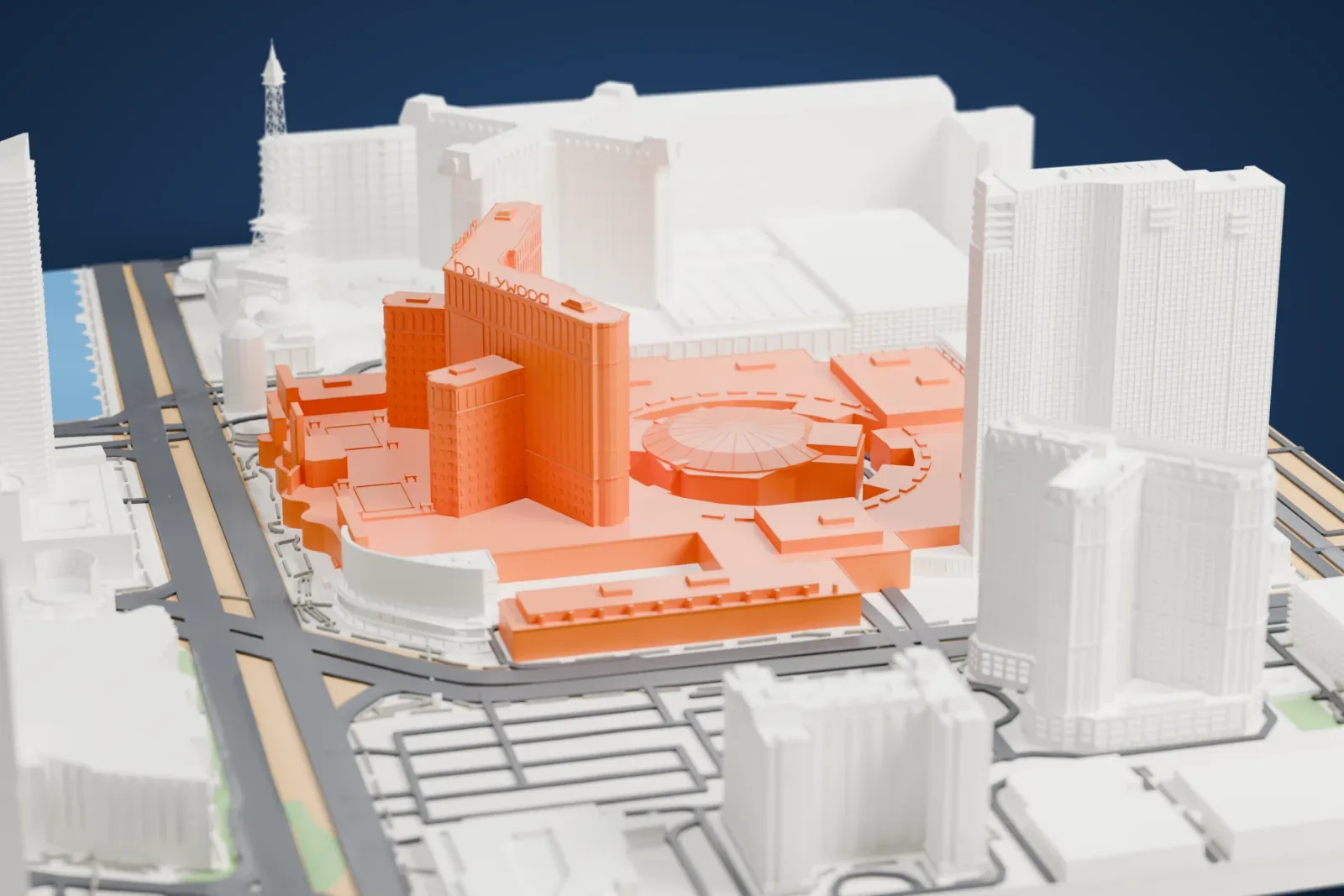 A white 3D print of Planet Hollywood Las Vegas, a curved hotel tower and a round domed theater on a wide low base, among neighboring resorts and roads.
