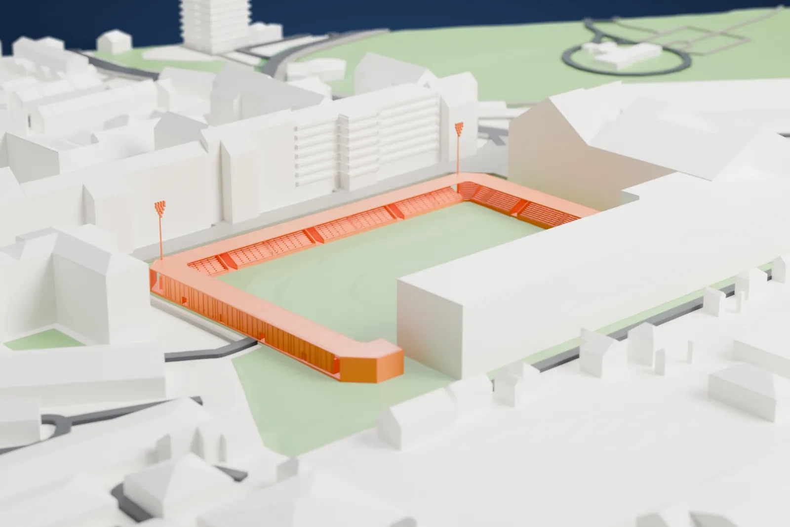A white 3D print of Plough Lane, showing three low covered stands around an open pitch.