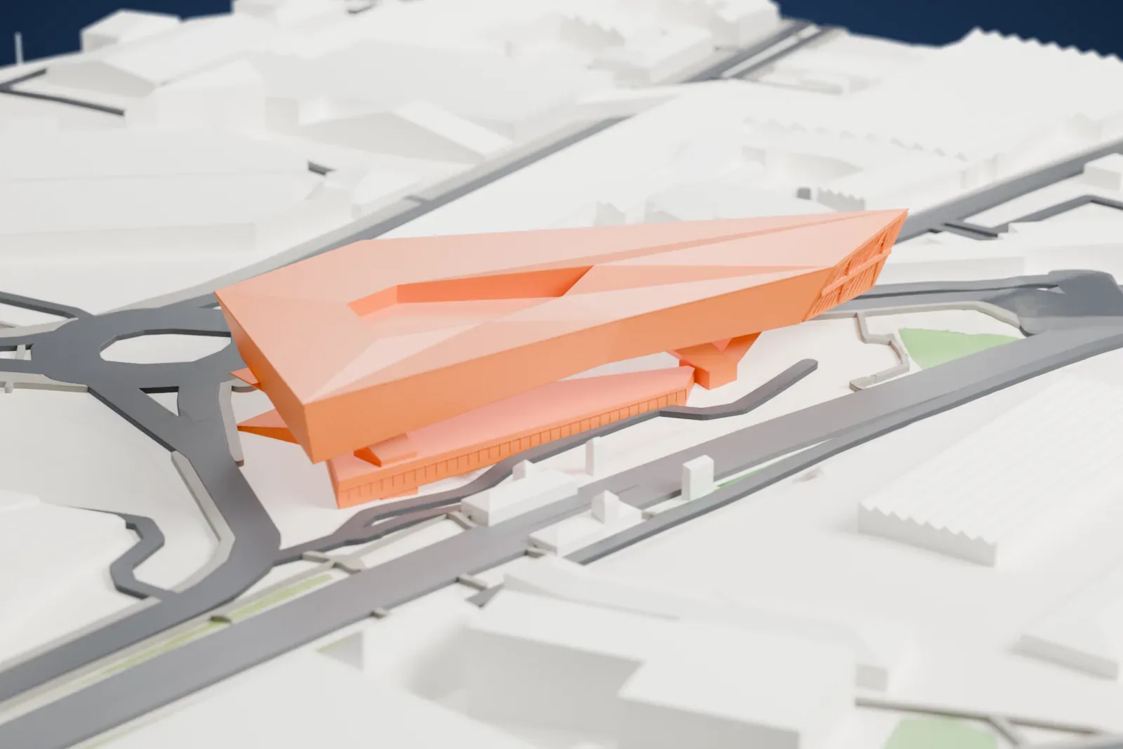 A white 3D print of the Porsche Museum, a large exhibition building on a junction, with streets and buildings around it in Zuffenhausen.