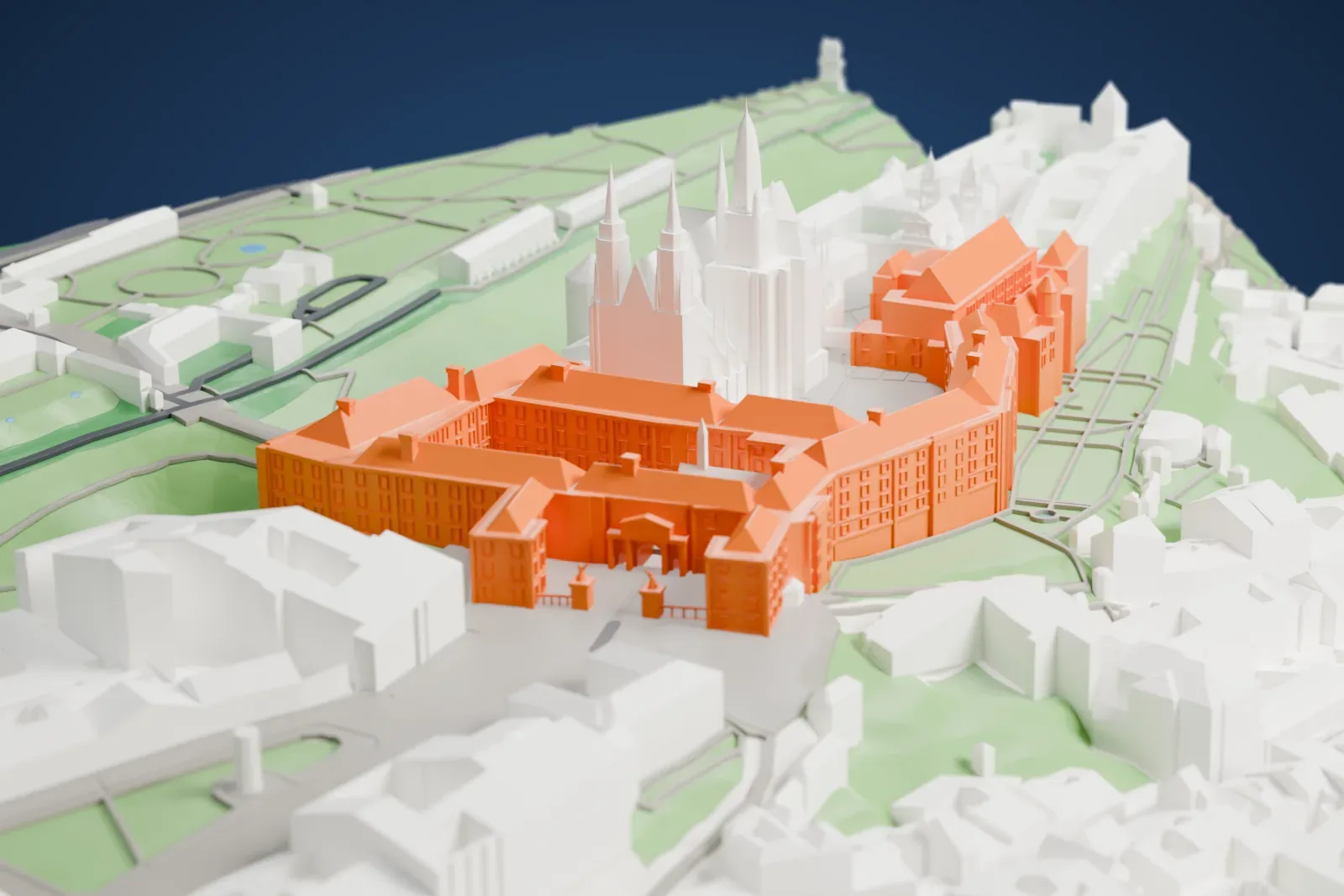 A white 3D print of Prague Castle, a long complex of palace wings, courtyards and turrets, with the cathedral and the streets of Hradčany around it.