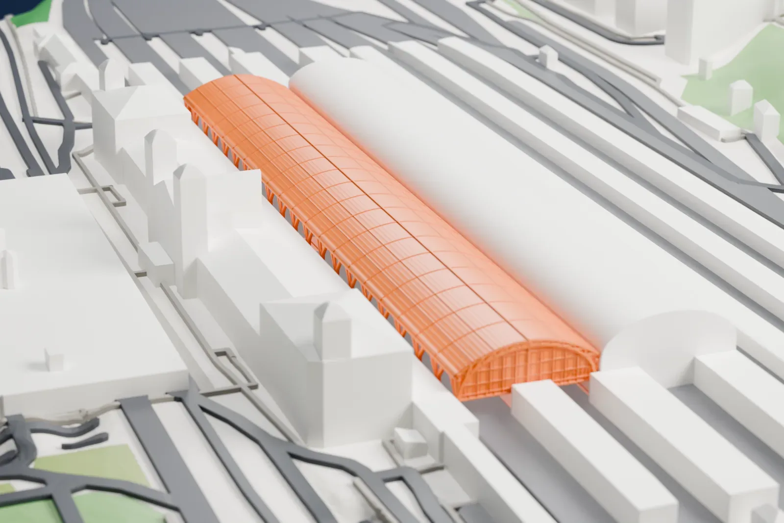 A white 3D print of Praha hlavní nádraží, with its station buildings among surrounding streets and buildings.