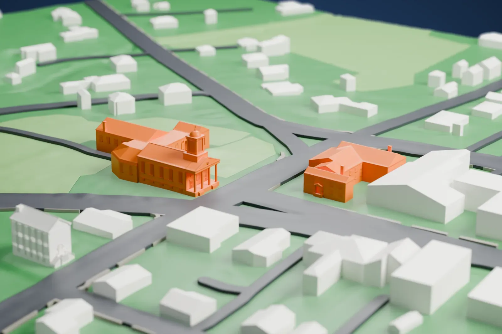 A white 3D print of the Presbyterian Church in Basking Ridge, a church with a small cupola above its front, set among lawns, roads and a few houses.
