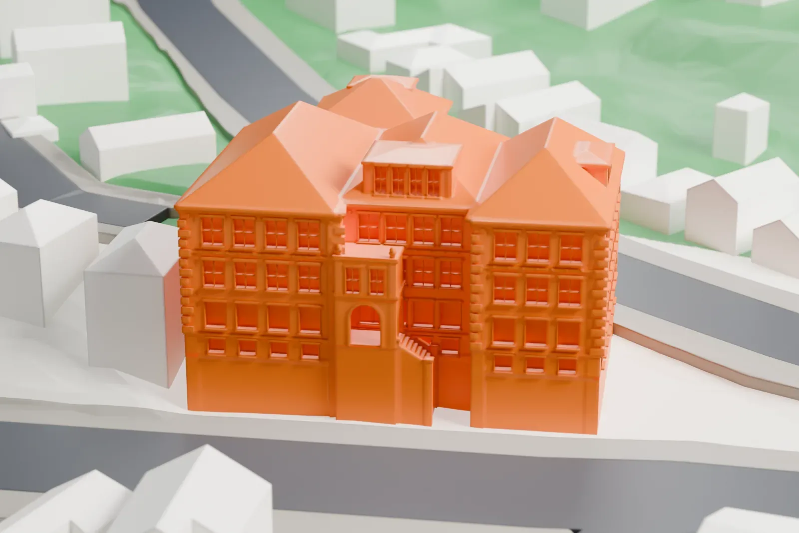 A white 3D print of Public School No. 13 in Yonkers, shown among the surrounding streets and buildings.