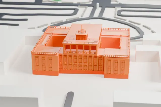 A white 3D print of the Pulkovo 2 historic terminal model in St Petersburg, with the streets around it.