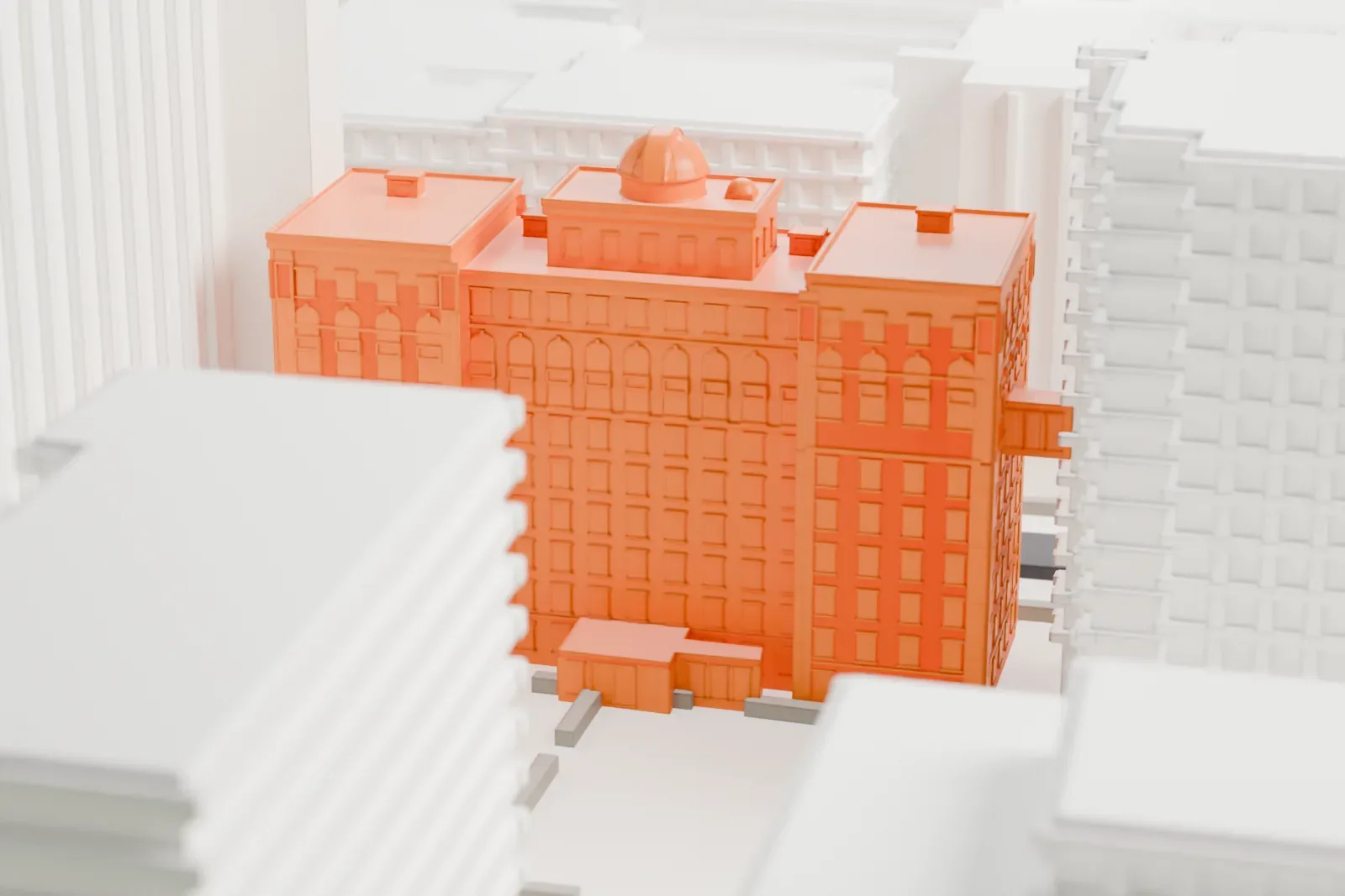 A white 3D print of Pupin Hall, a multi-wing building with a small dome on its roof, surrounded by taller buildings and streets.