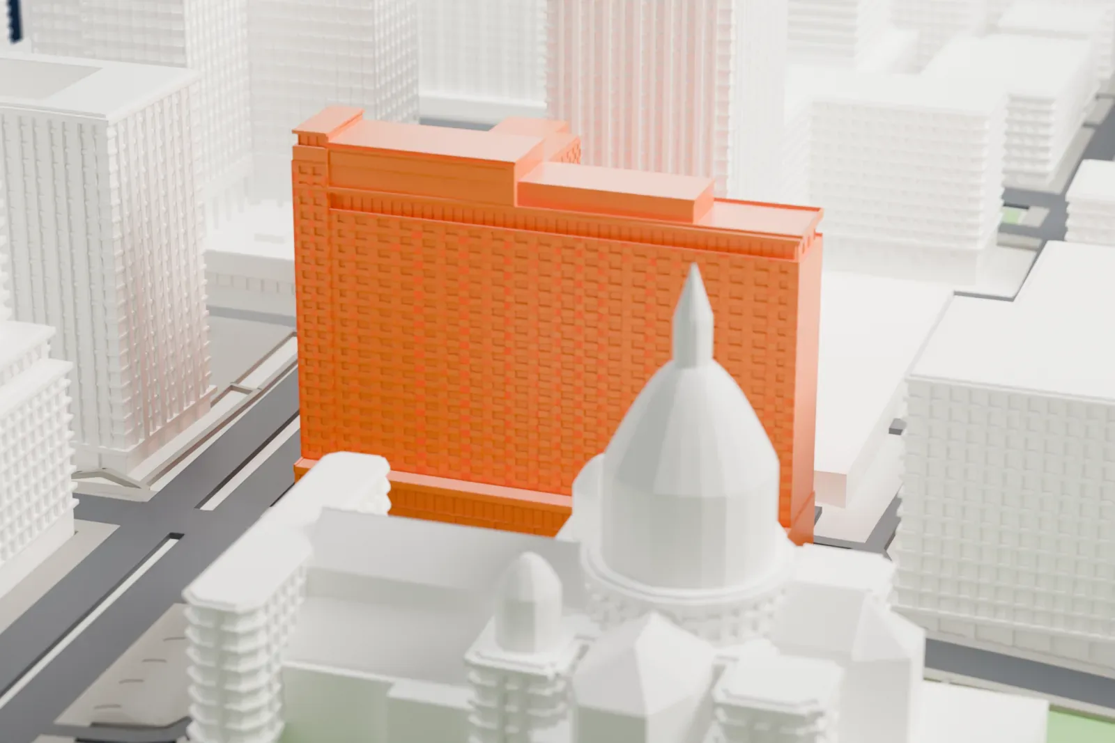 A white 3D print of the Queen Elizabeth Hotel in Montreal among the surrounding streets and buildings of downtown.