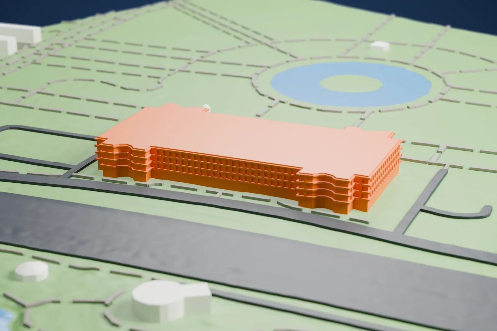 A white 3D print of the Queens Museum, a long low building with a colonnaded front and rooftop skylights, set among park lawns, paths, a round pond and nearby roads.