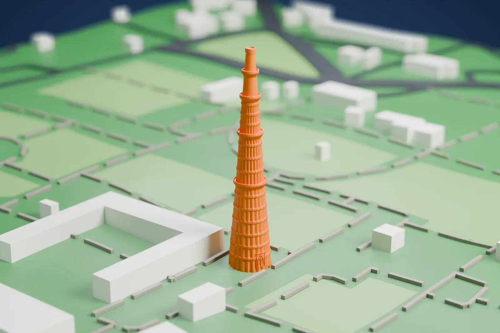 A white 3D print of the Qutb Minar, a tall tapering fluted tower with ringed balconies, standing among lawns, paths and low buildings.