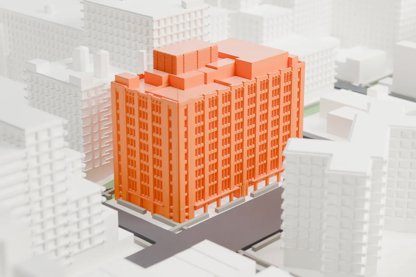 A white 3D print of the R. C. Williams Warehouse, a tall block with rows of window bays and louvered boxes on the roof, among other large buildings.