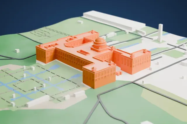 A white 3D print of Rashtrapati Bhavan, a wide H-shaped building with a central dome and small roof pavilions, standing near gardens with water channels.