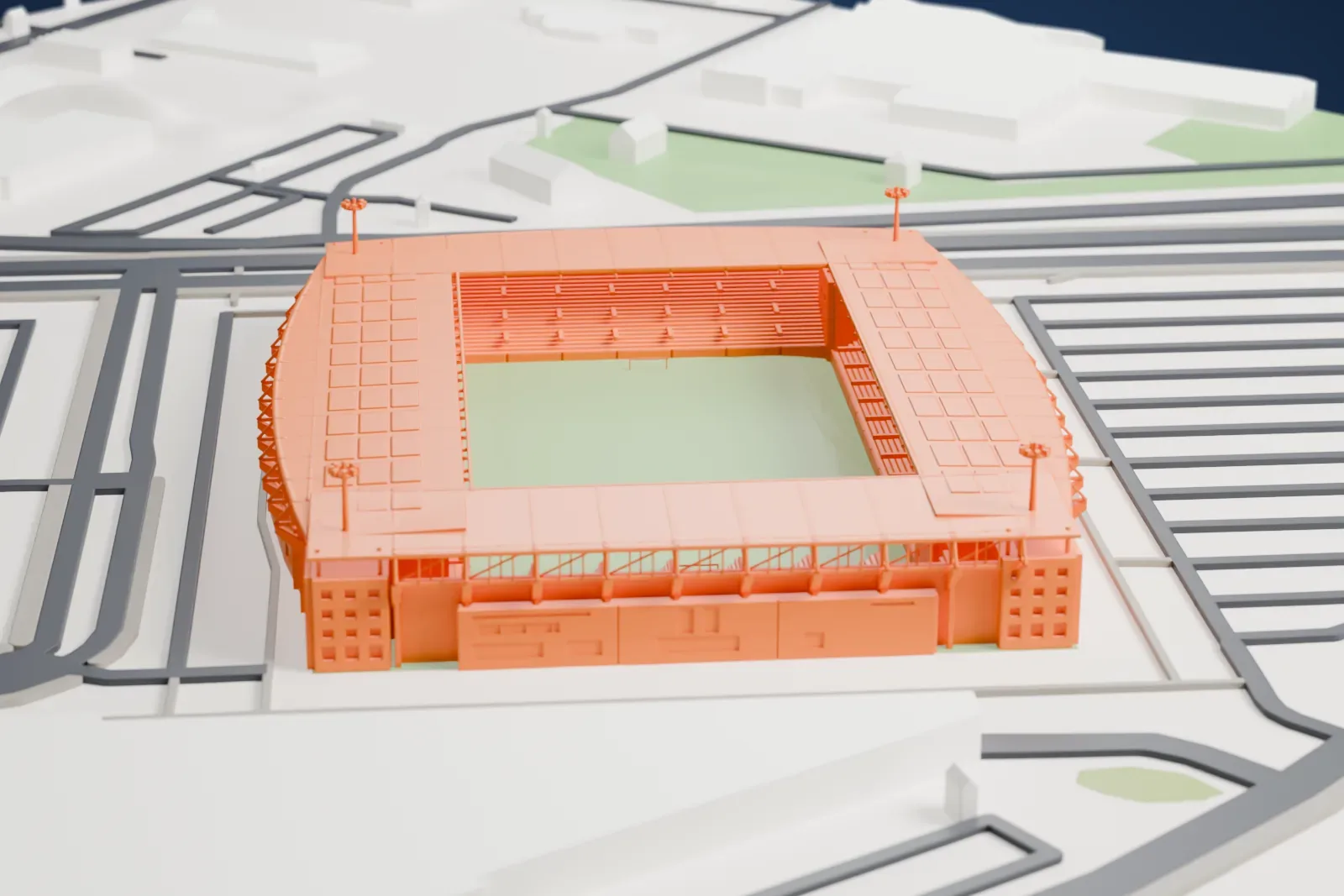 A white 3D print of the Rat Verlegh Stadion, with four shallow roofs and slender floodlight poles around an open pitch, in surrounding streets.