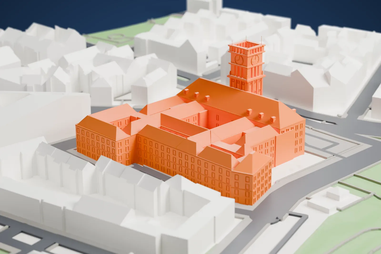 A white 3D print of the Rathaus Schöneberg, a stone city hall with a tower, among the surrounding streets and buildings of Berlin.