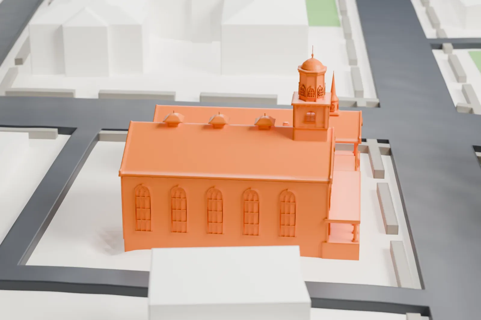 A white 3D print of the Reformed Church of Newtown, a pitched-roof church with a small cupola tower and a lower porch wing, standing at a street corner among larger buildings.