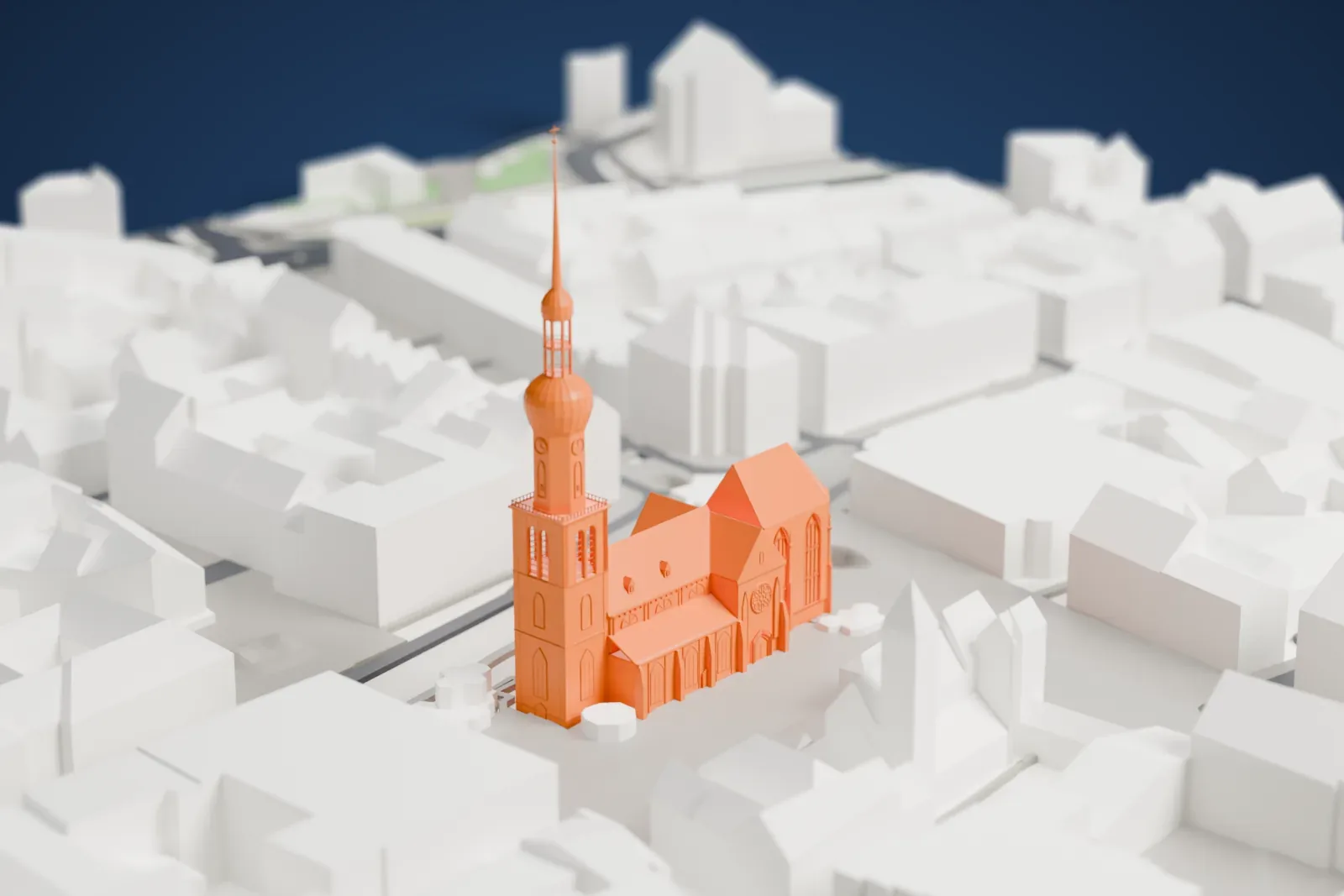 A white 3D print of St. Reinold's Church with its tall tower rising above the surrounding streets and buildings.
