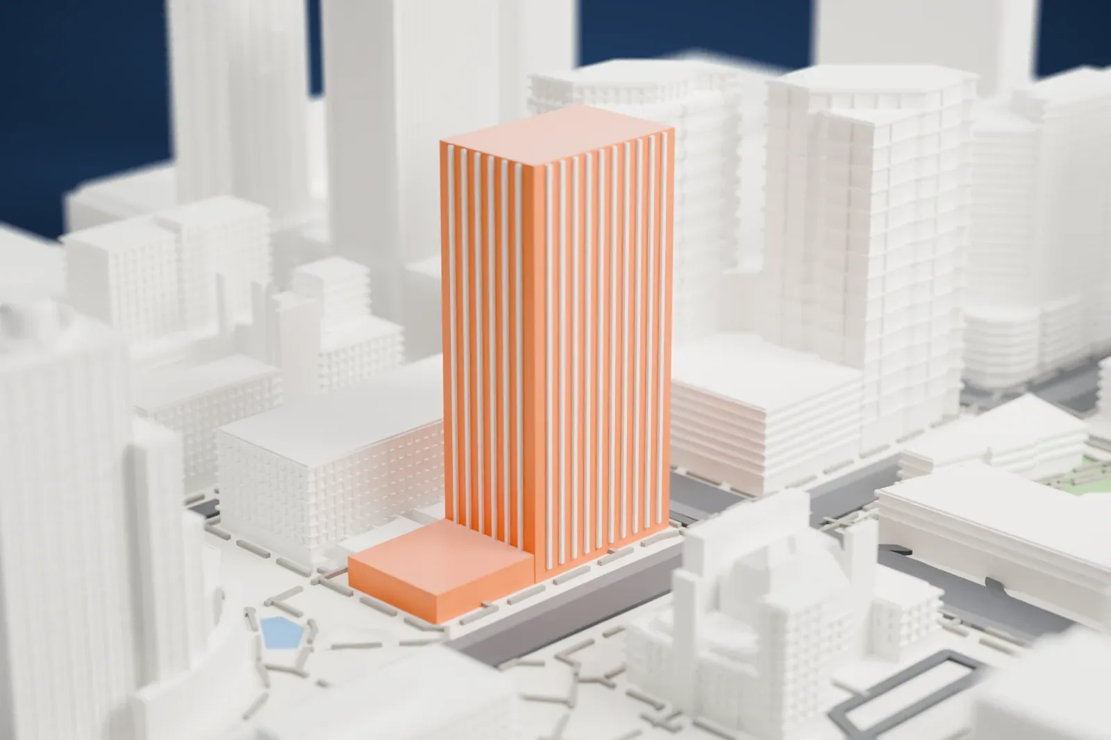 A white 3D print of Renaissance Square, two tall office towers with angled tops joined by a skyway, standing among other downtown buildings and streets.