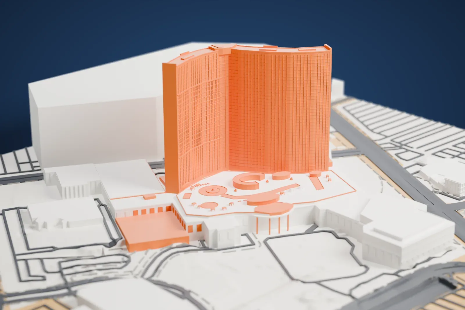 A white 3D print of Resorts World Las Vegas, a tall curved tower rising from a wide, low podium among neighboring buildings and streets.