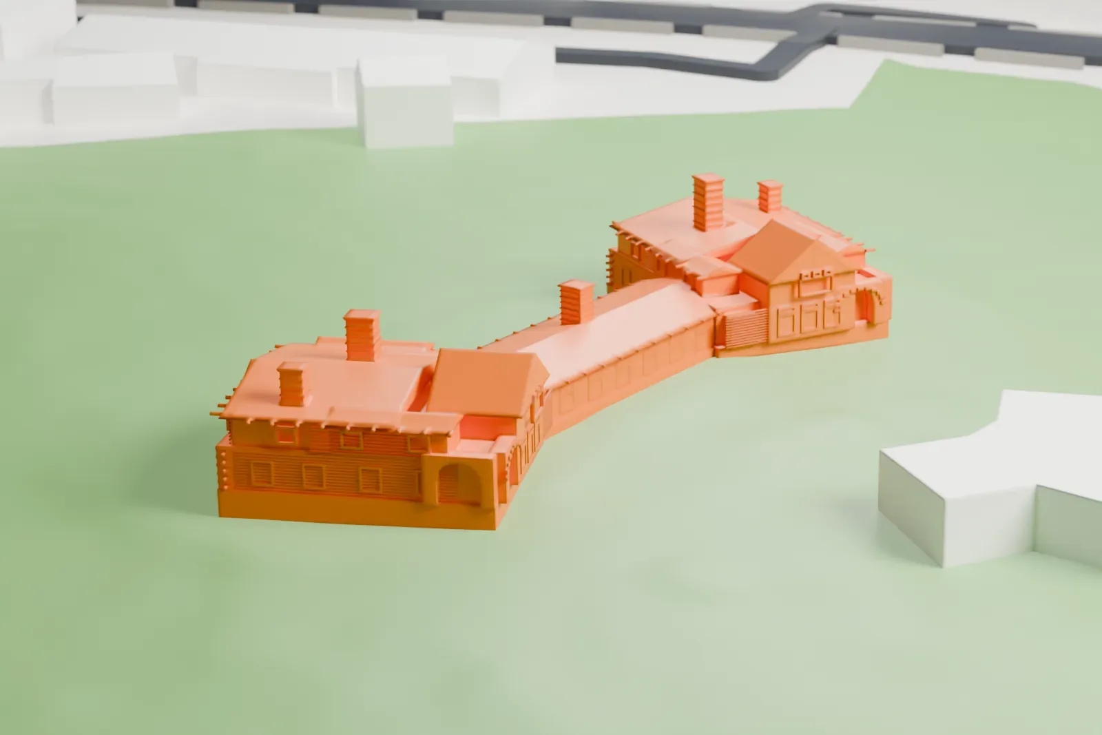 A white 3D print of Riordan Mansion, two gabled wings with chimneys joined by a long low connecting room, standing on open lawn with a few buildings nearby.