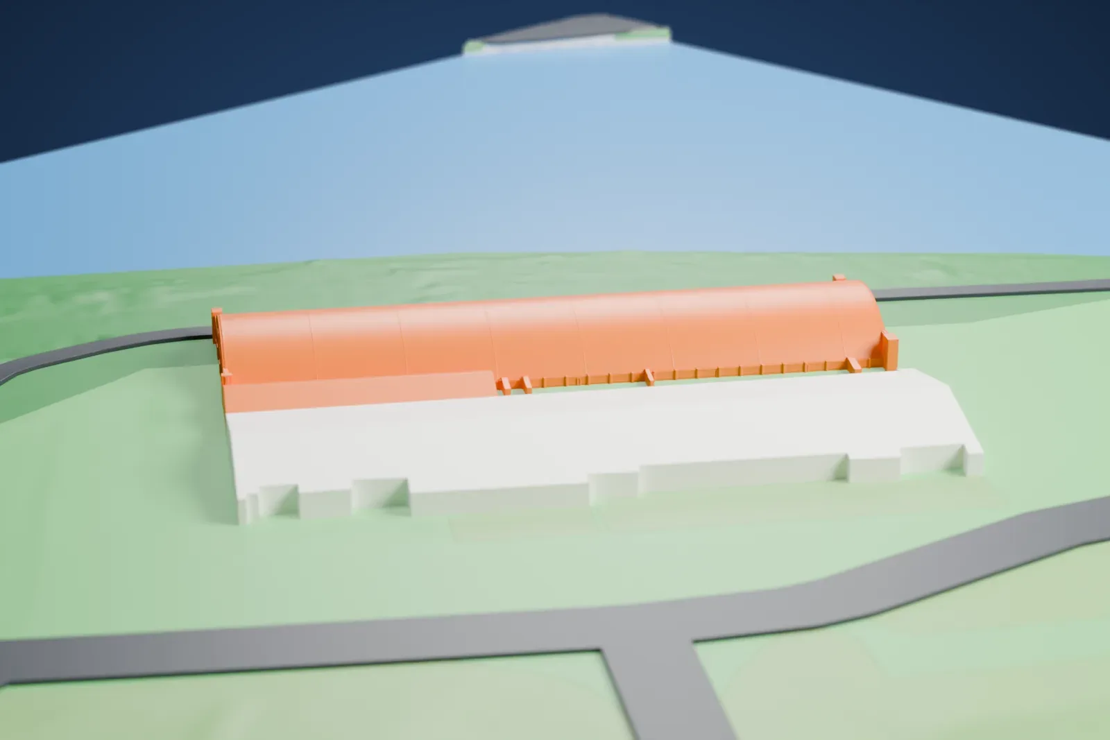 A white 3D print of the Riverside Hangar, a long arched-roof hangar with a similar hangar beside it, between green land and open water.