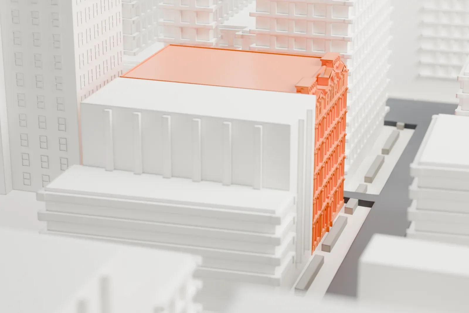 A white 3D print of the Robbins & Appleton Building, a small building in a dense block of taller and lower buildings.