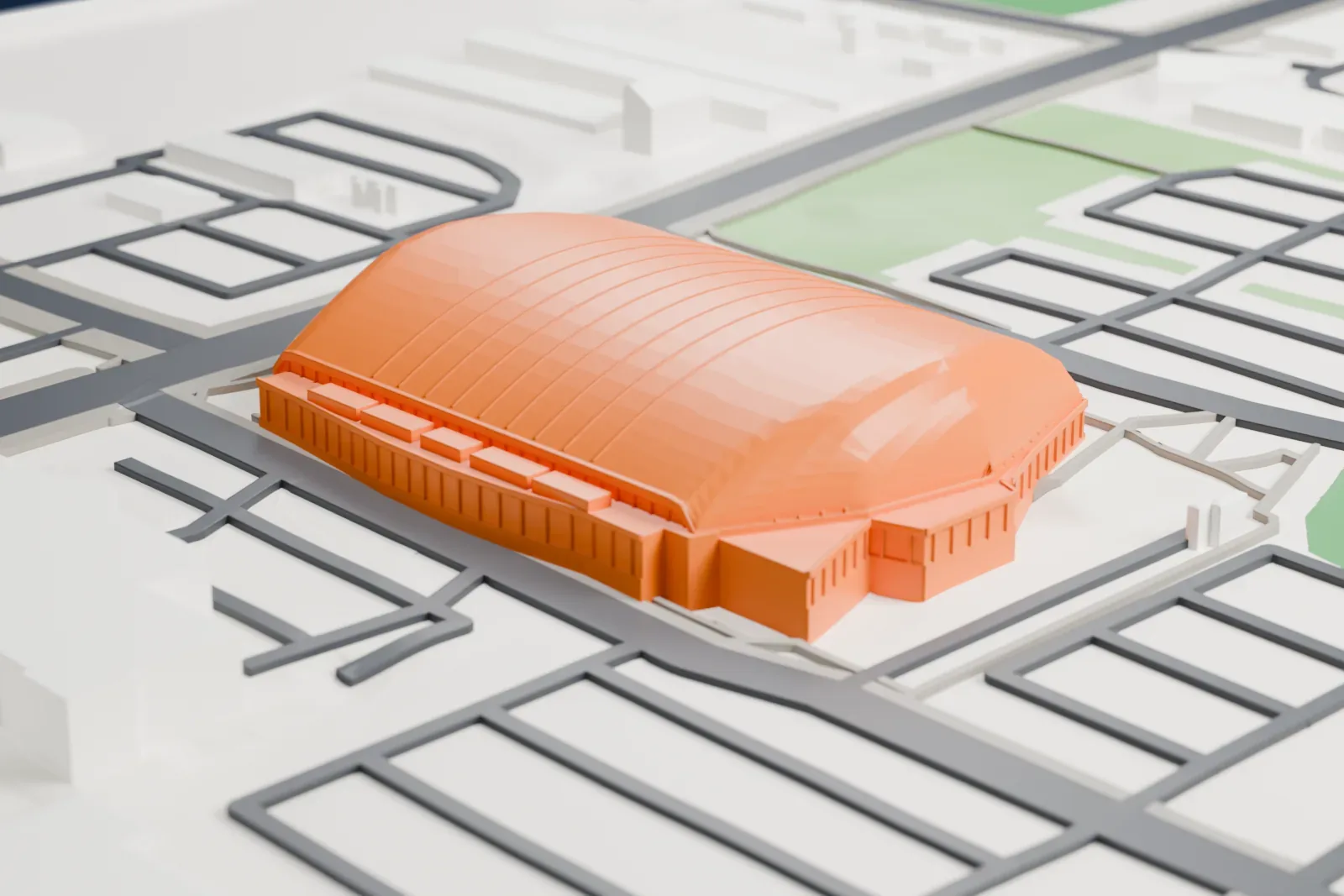 A white 3D print of Rogers Forum, a hockey arena, surrounded by streets and buildings.
