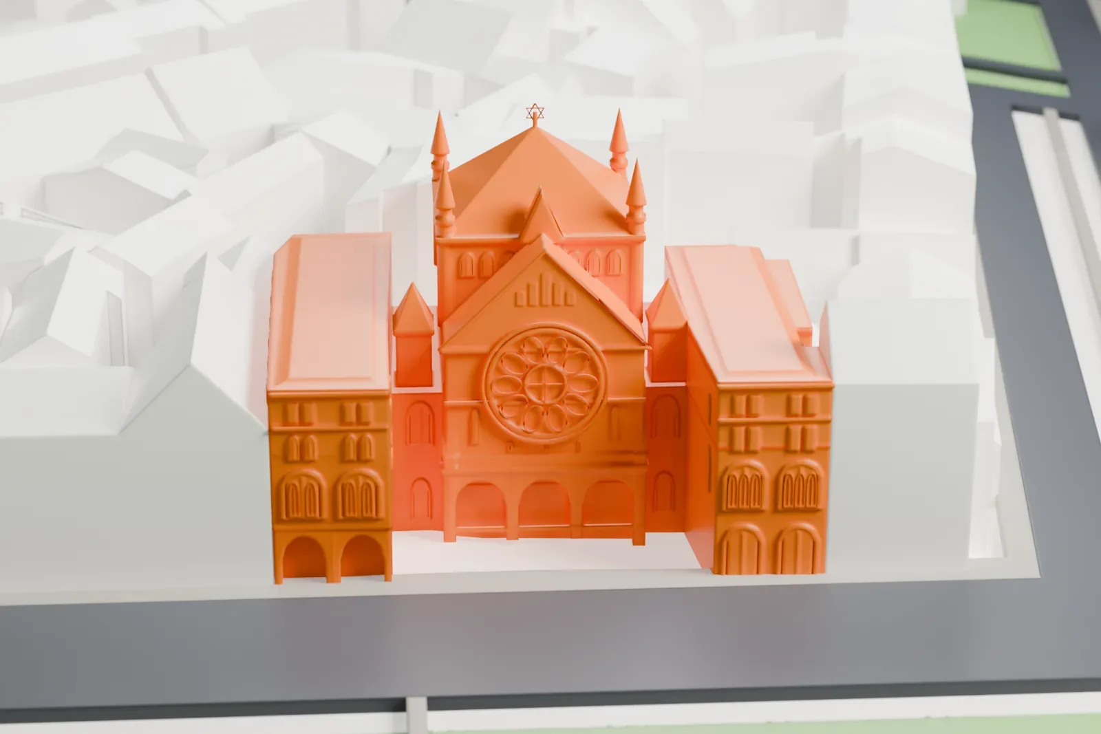 A white 3D print of the Roonstrasse Synagogue among the surrounding streets and buildings.