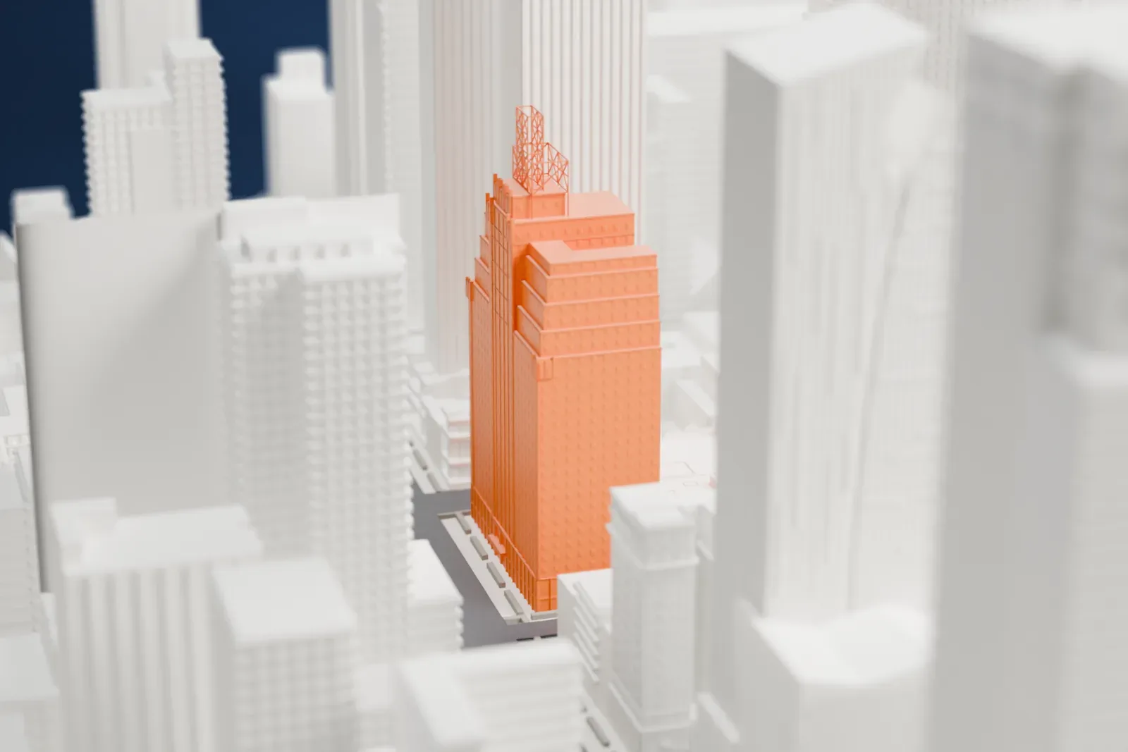 A white 3D print of the Row NYC Hotel, a tall tower with an open lattice structure on its roof, among other high-rise buildings in Midtown Manhattan.
