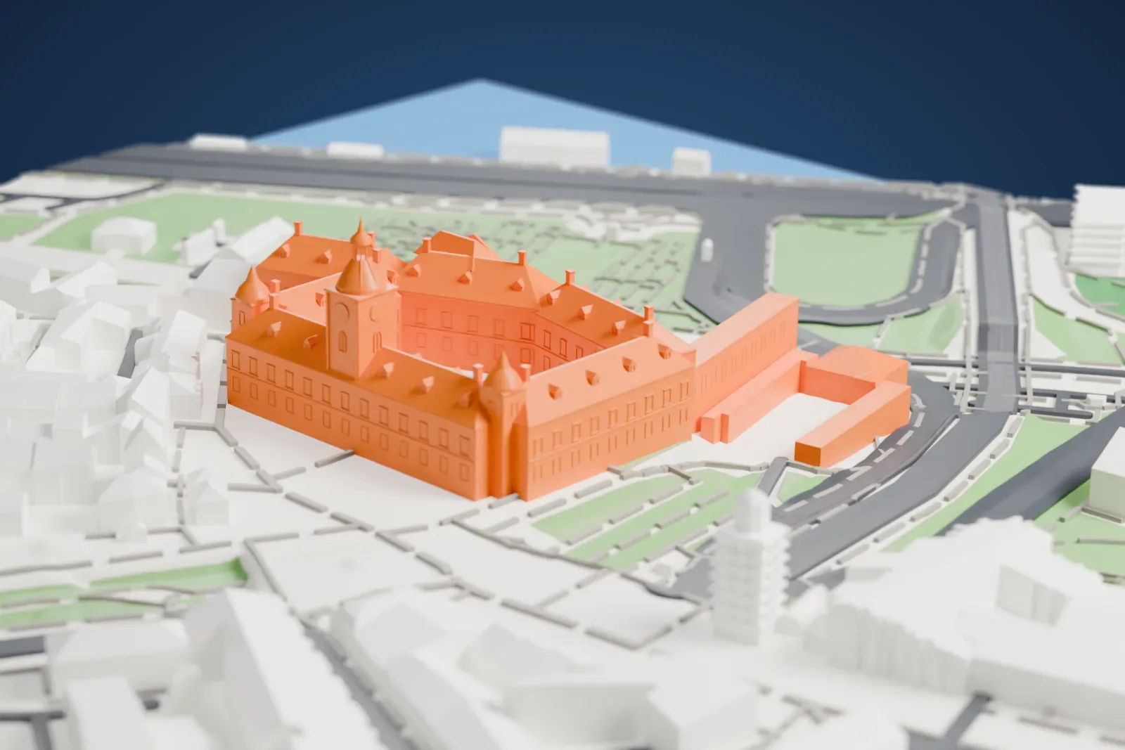 A white 3D print of the Royal Castle in Warsaw, a large palace of steep-roofed wings around a courtyard with a tall tower and small domed turrets, beside a green slope, roads and closely packed buildings.