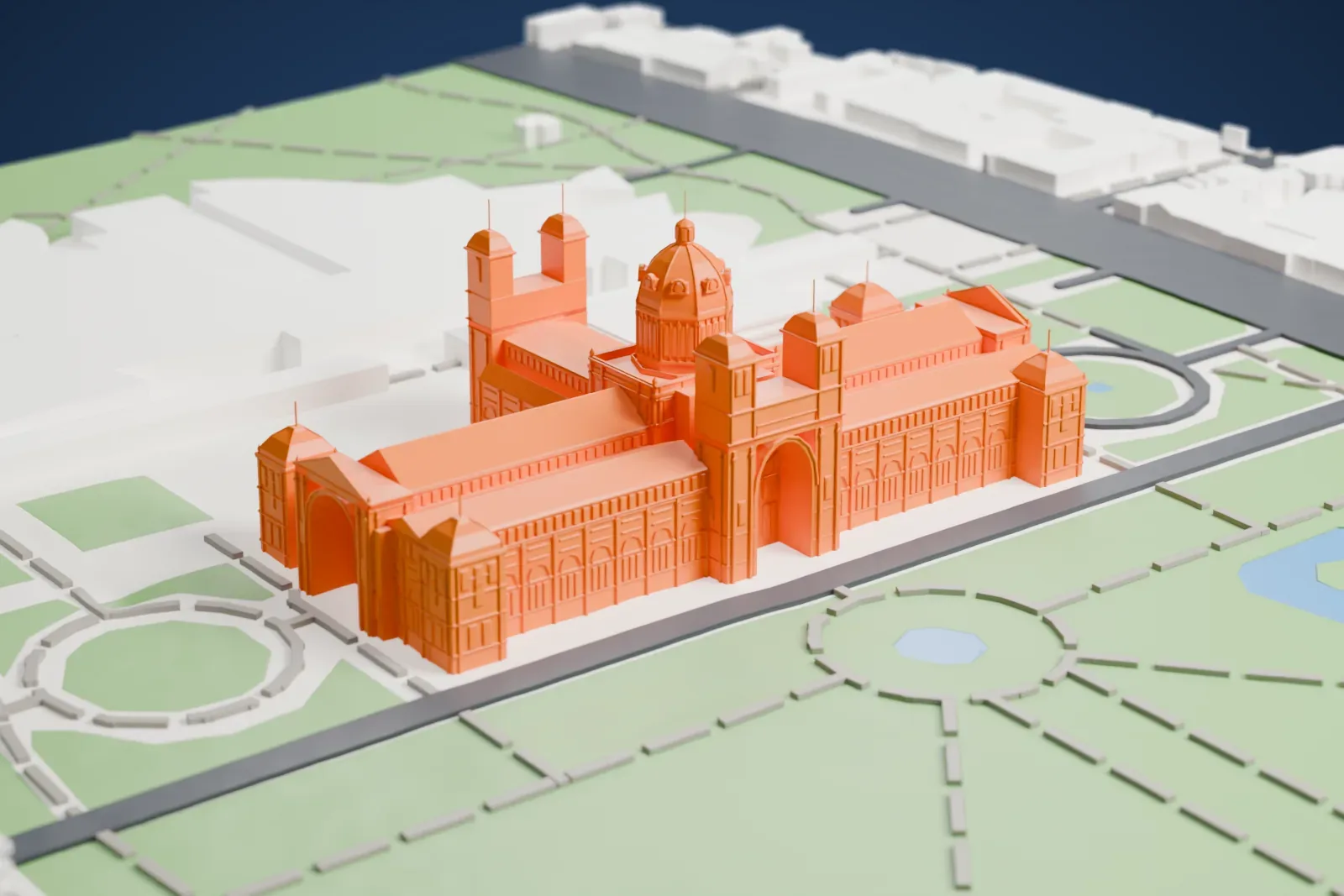 A white 3D print of the Royal Exhibition Building, a long building with a central domed drum, small domed corner towers with thin spires and rows of arched windows, set in a park with paths and ponds.