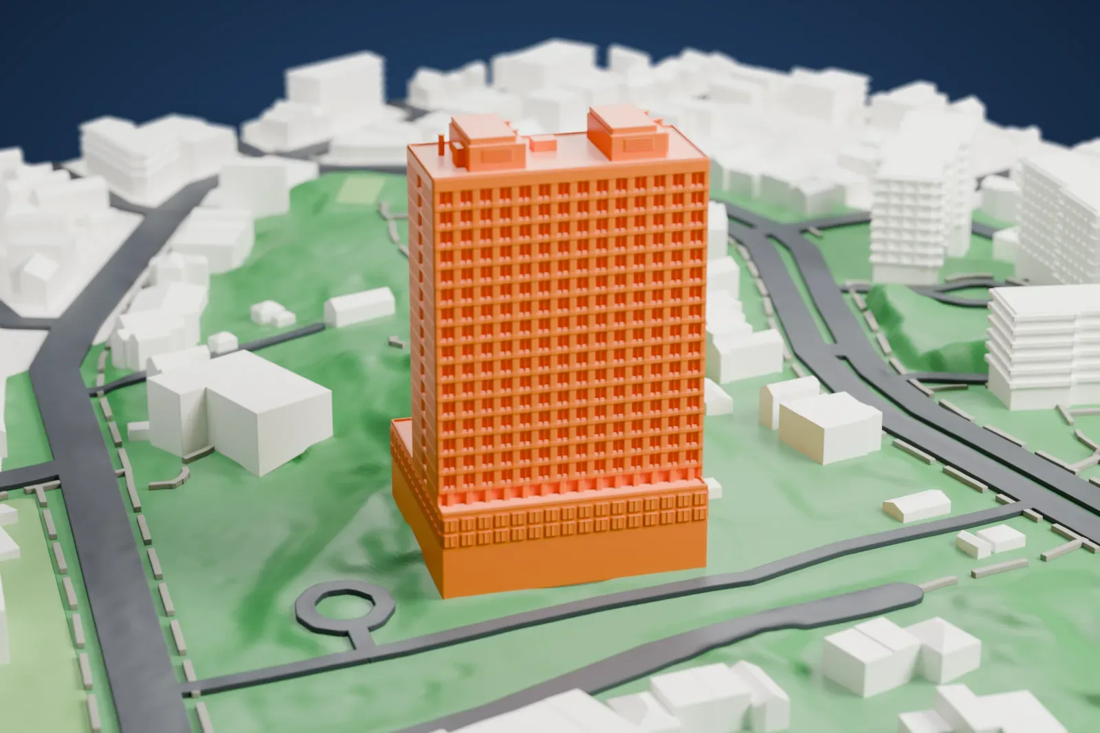 A white 3D print of the Russian Mission Residency, a tall tower with a dense grid of windows and small rooftop boxes, joined to a low wing and set on green, hilly ground with roads and houses around it.