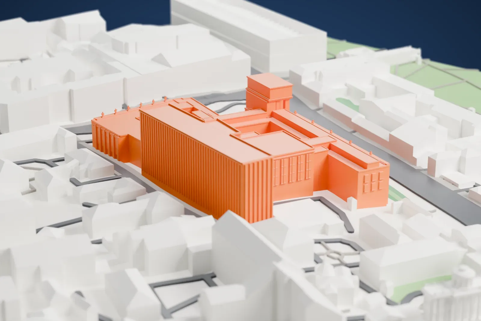 A white 3D print of the Russian State Library, a large building with a long facade, among the surrounding streets and buildings of Moscow.