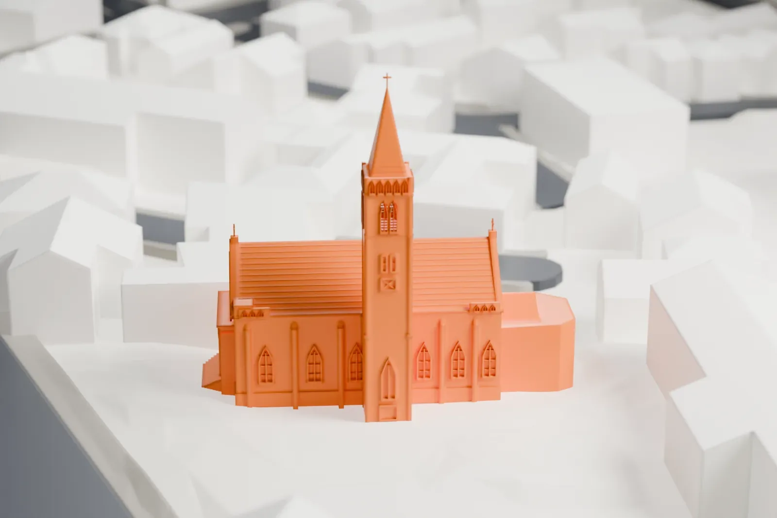 A white 3D print of the Sacred Heart Cathedral in Yokohama, a church building standing among city streets and buildings.