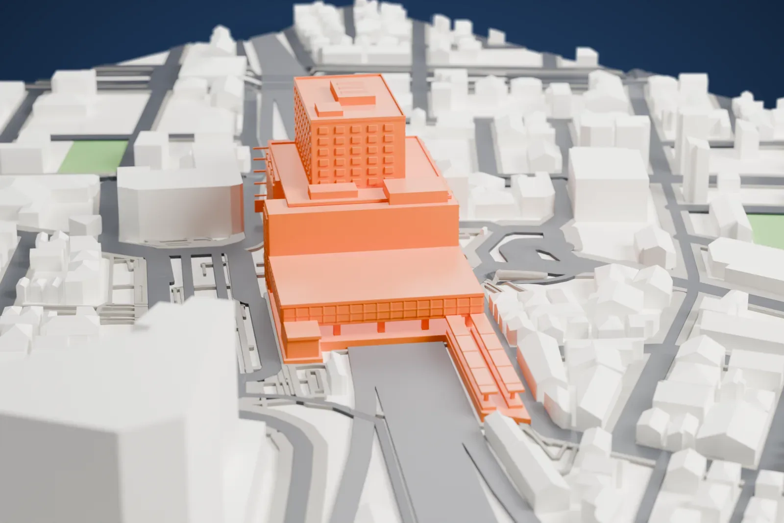 A white 3D print of Sagami-Ōno Station, with its station building and the surrounding streets and buildings.