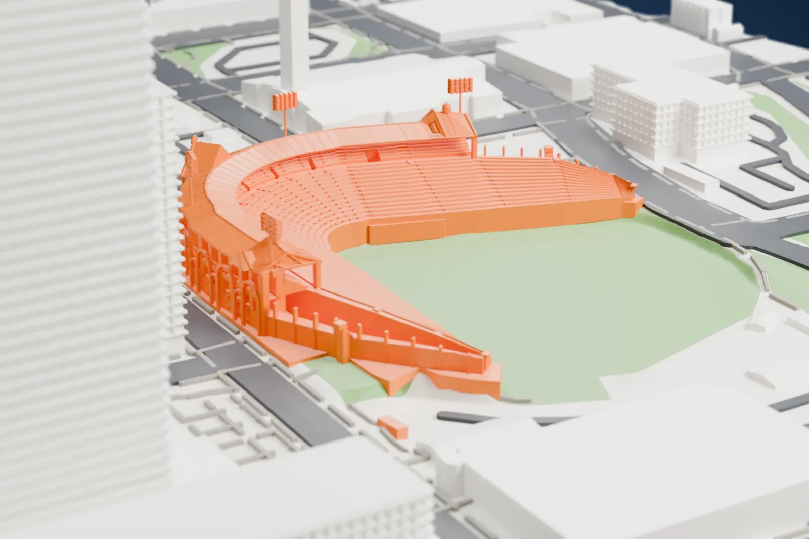 A white 3D print of Sahlen Field, a horseshoe-shaped ballpark with arched outer walls and light towers around a green field, among the streets and buildings of downtown Buffalo.