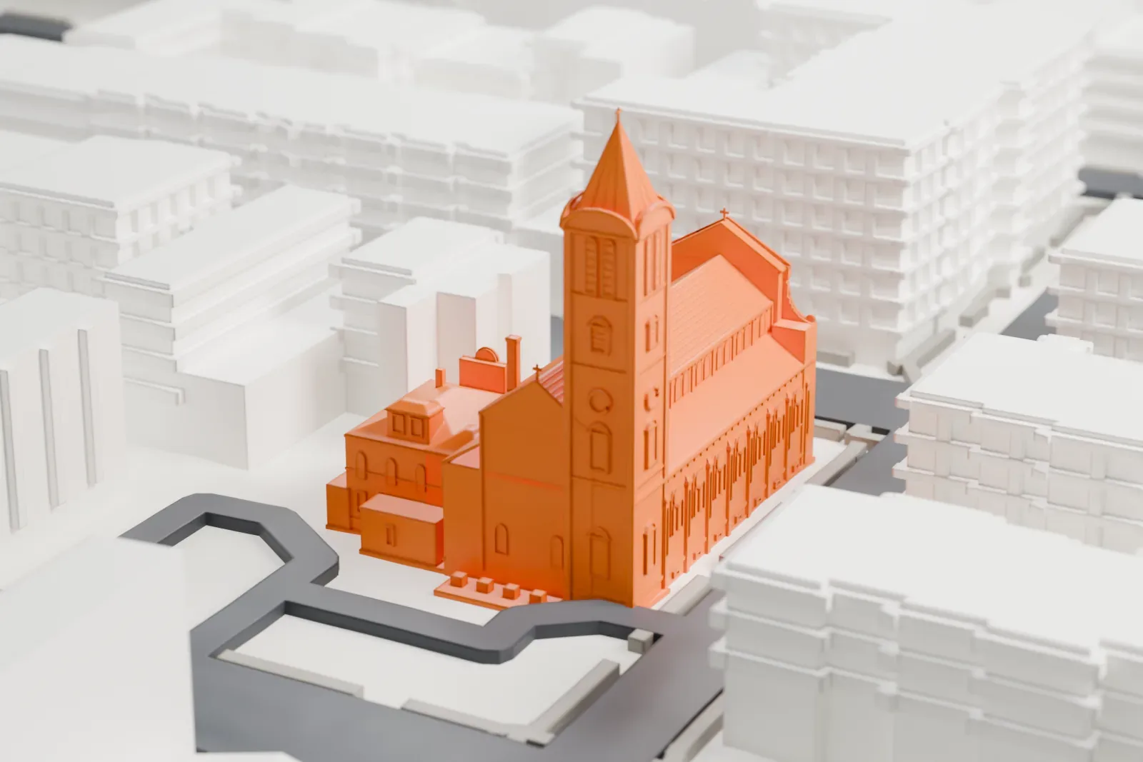 A white 3D print of Saint Ann Church and Rectory, a long church with a tall pointed bell tower, set among streets and neighboring buildings.