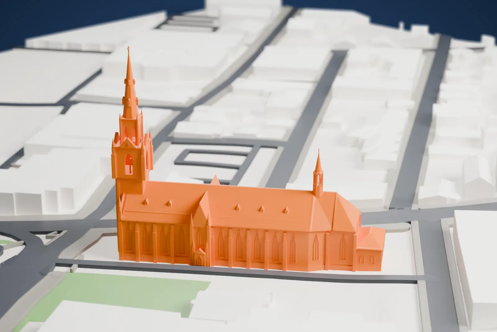 A white 3D print of the Saint-Germain Cathedral with the surrounding streets and buildings.