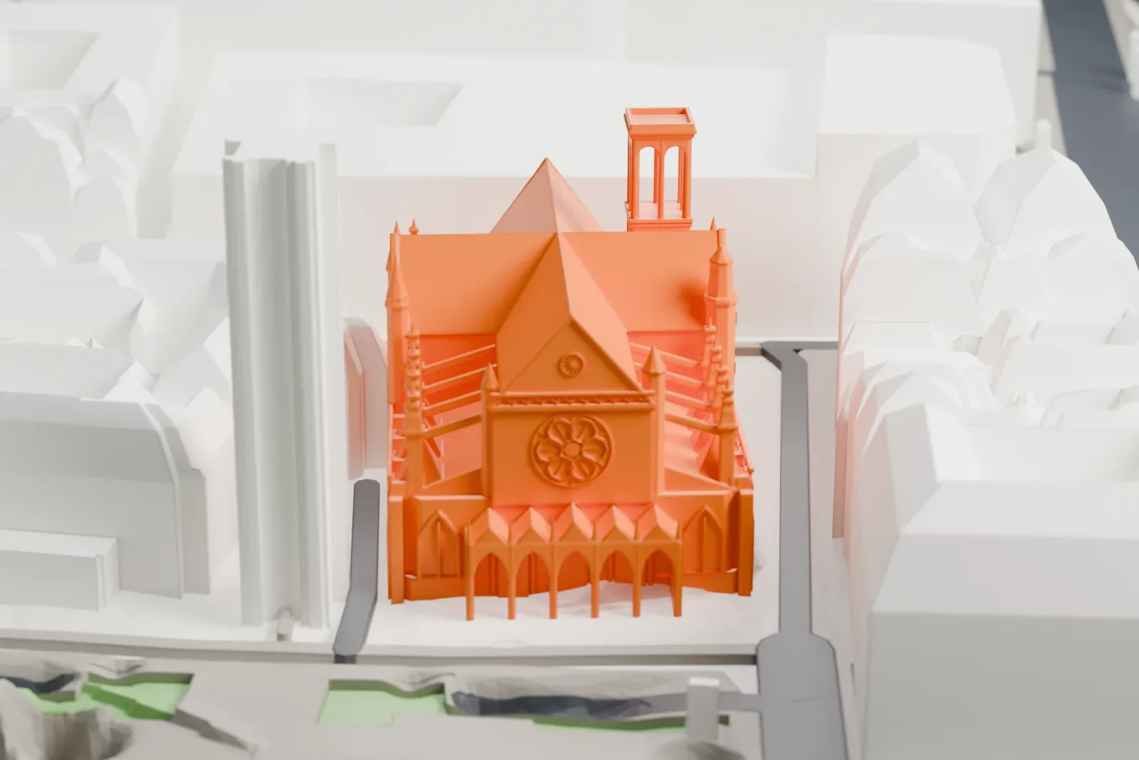 A white 3D print of Saint-Germain l'Auxerrois among the surrounding streets and buildings in Paris.