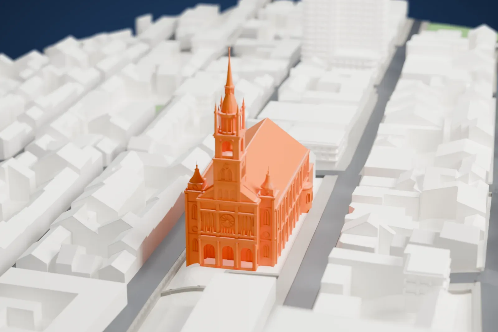 A white 3D print of Saint-Jean-Baptiste Church with the surrounding streets and buildings.