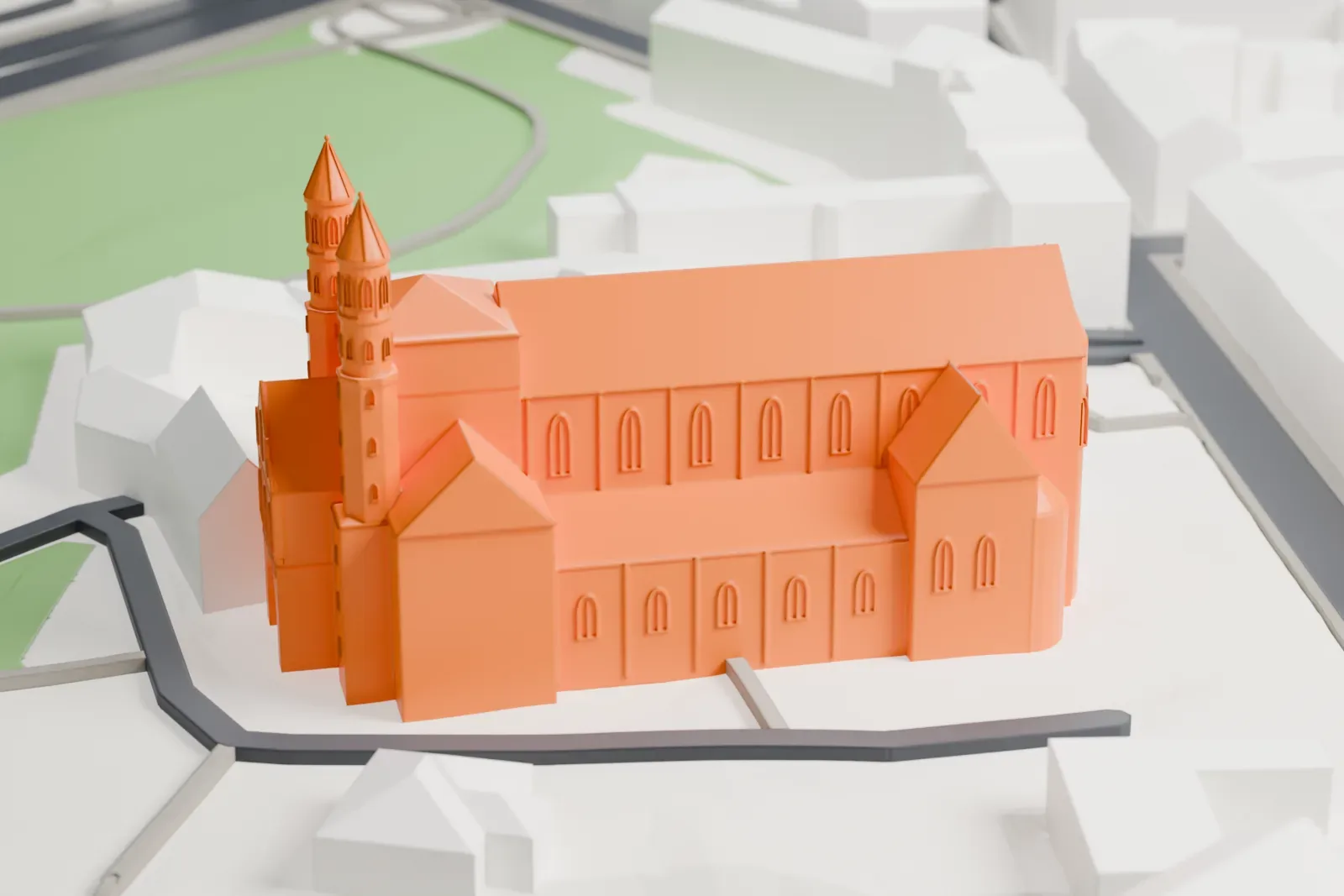A white 3D print of Saint Pantaleon in Cologne, standing among surrounding city buildings.