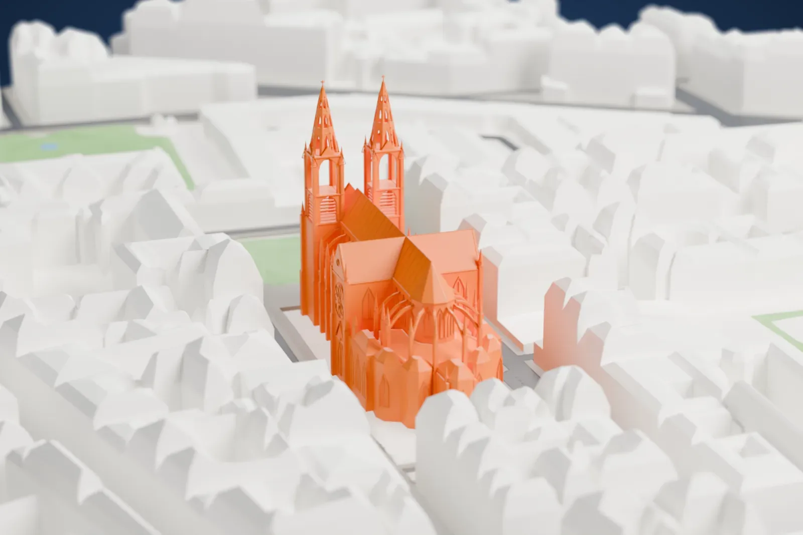 A white 3D print of the Basilica of Sainte-Clotilde, a neo-Gothic church with two spires, among the surrounding buildings of Paris.