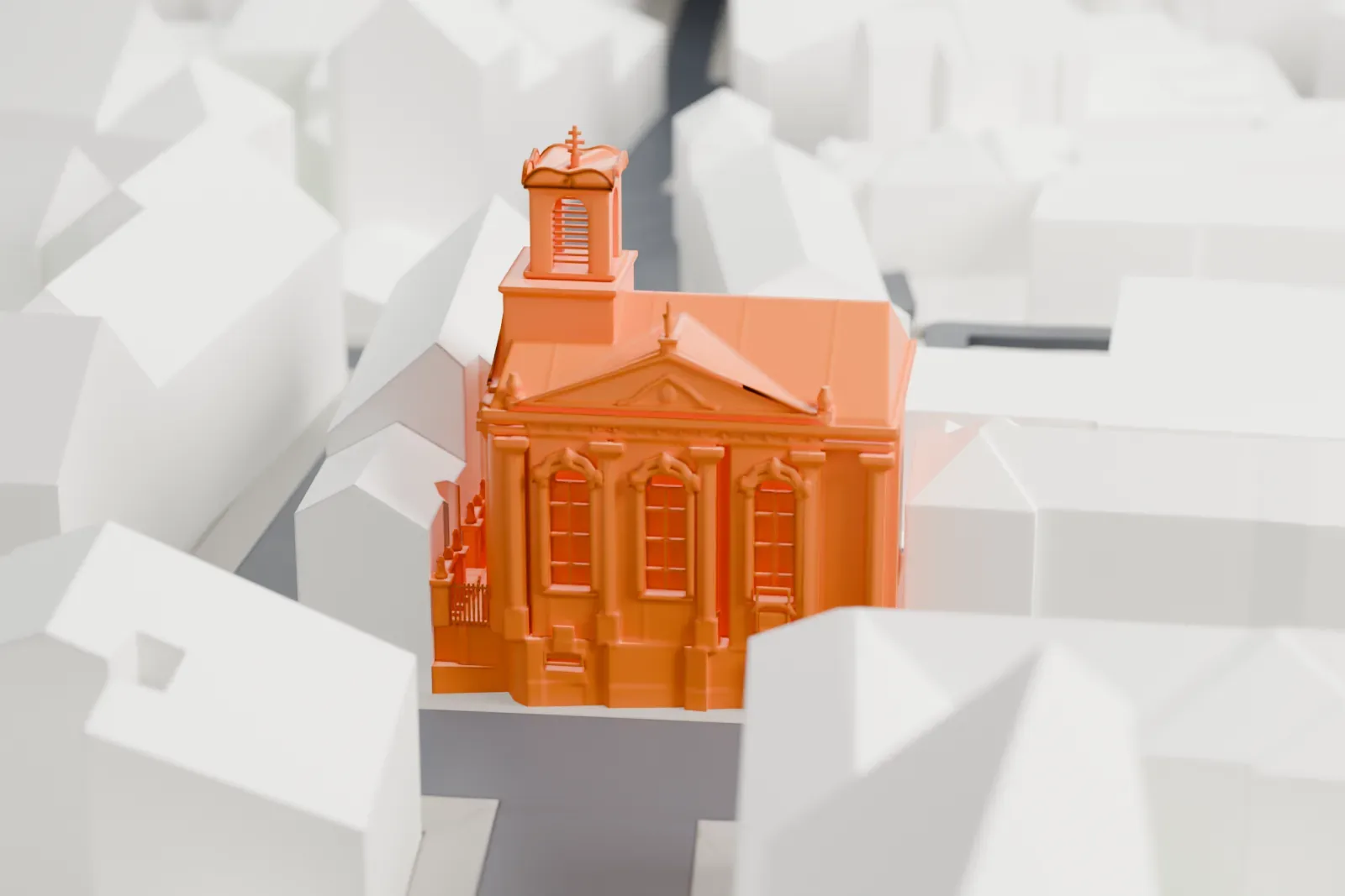 A white 3D print of the Saints Cyril and Methodius Cathedral among the streets and buildings of Nové Město in Prague.