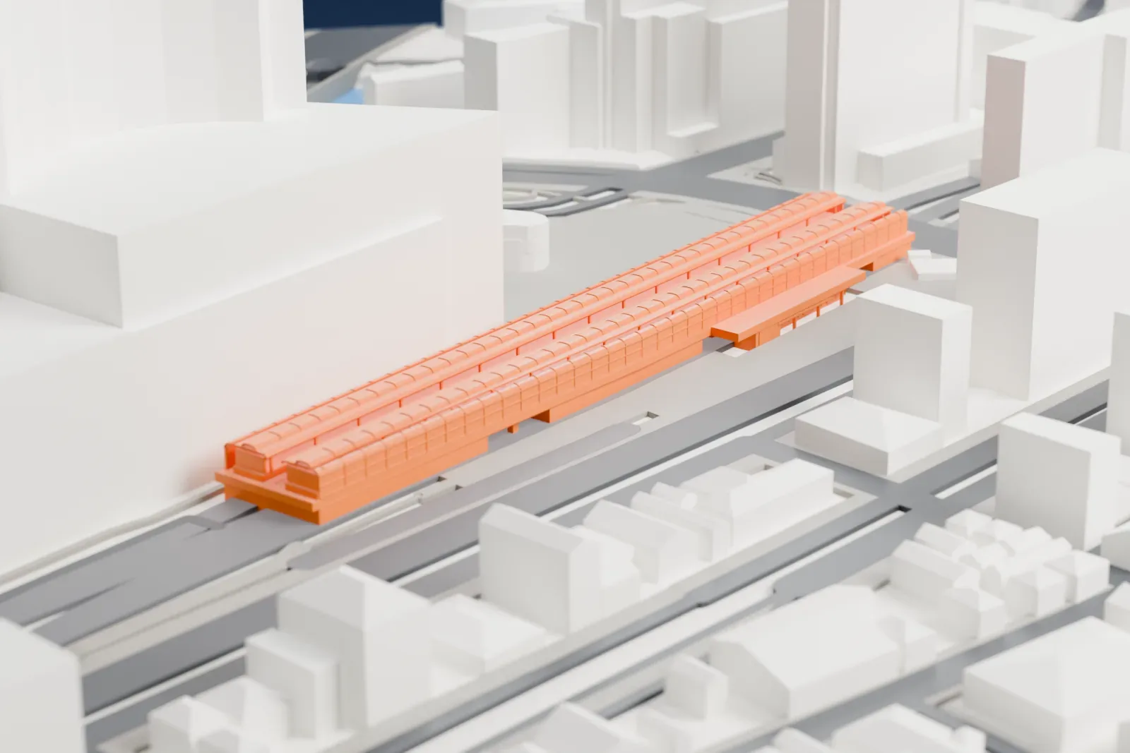 A white 3D print of Sakuragichō Station, a long station building, among the surrounding city buildings of Yokohama.