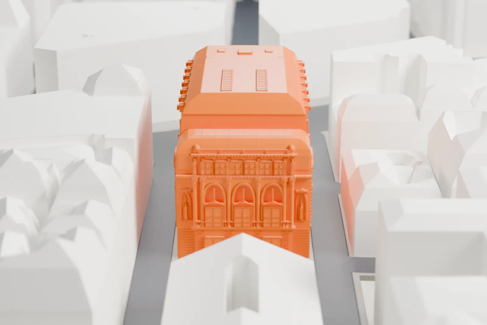 A white 3D print of the Salle Favart, with surrounding streets and buildings on Place Boïeldieu.